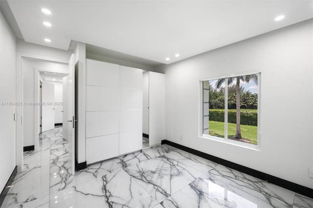 5121 SW 210th Ter, Southwest Ranches, FL 33332 - unfurnished bedroom featuring recessed lighting, light marble finish floors, and baseboards