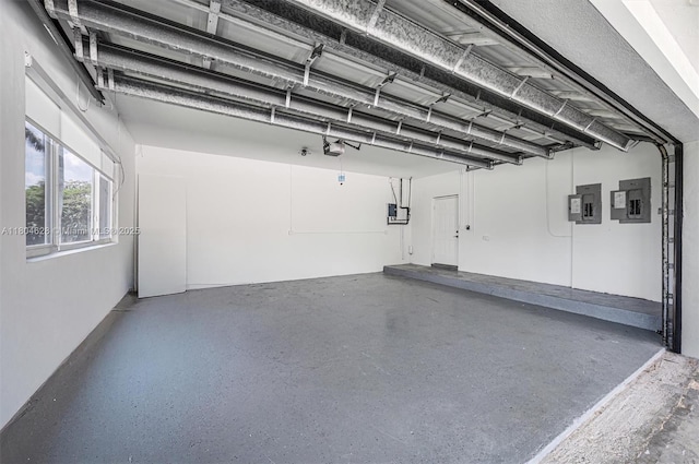5121 SW 210th Ter, Southwest Ranches, FL 33332 - garage featuring electric panel and a garage door opener