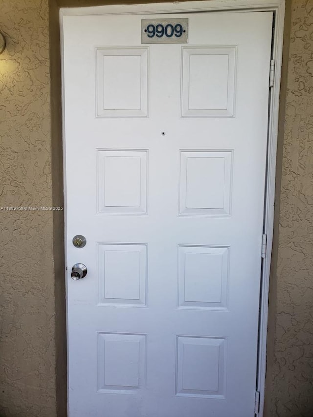 9909 Twin Lakes Dr Unit 26-F, Coral Springs, FL 33071 - detailed view of stucco siding