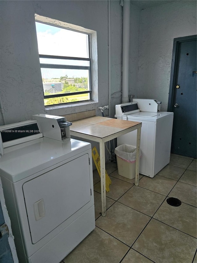 13500 NE 3rd Ct Unit 110, North Miami, FL 33161 - laundry room with washer and dryer and light tile patterned floors