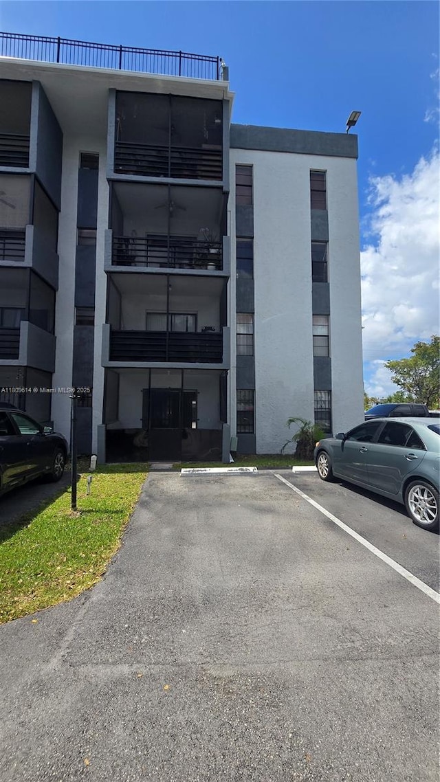 13500 NE 3rd Ct Unit 110, North Miami, FL 33161 - view of building exterior with uncovered parking