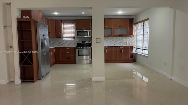 421 NE 1st St Unit 119, Hallandale Beach, FL 33009 - kitchen featuring appliances with stainless steel finishes, baseboards, open shelves, and recessed lighting
