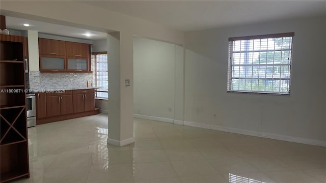 421 NE 1st St Unit 119, Hallandale Beach, FL 33009 - spare room featuring baseboards