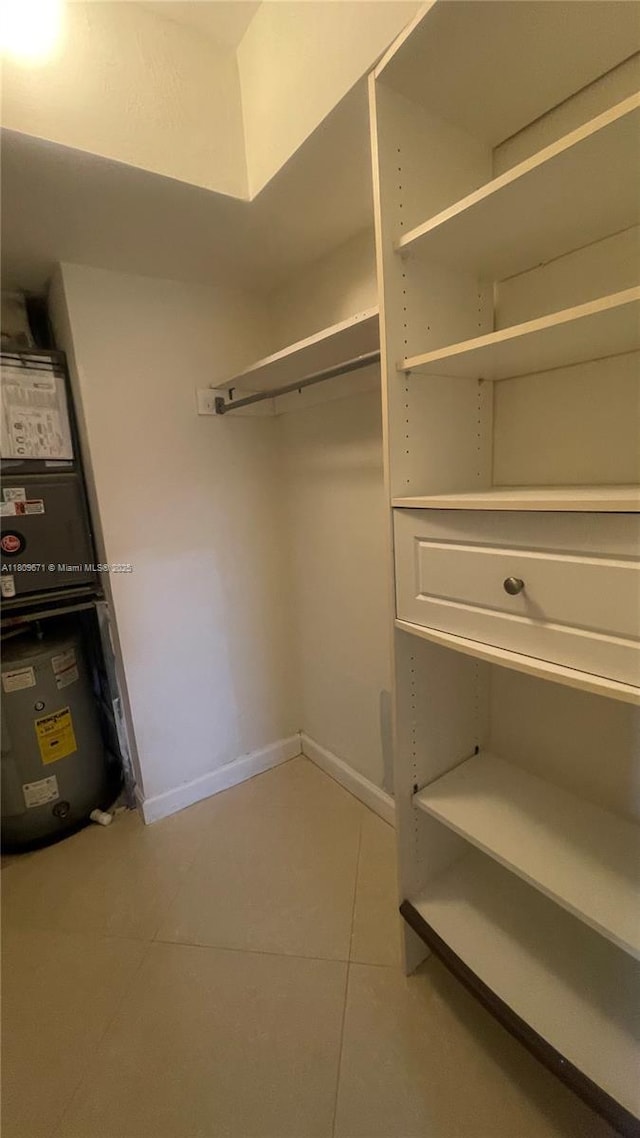 421 NE 1st St Unit 119, Hallandale Beach, FL 33009 - walk in closet featuring tile patterned flooring