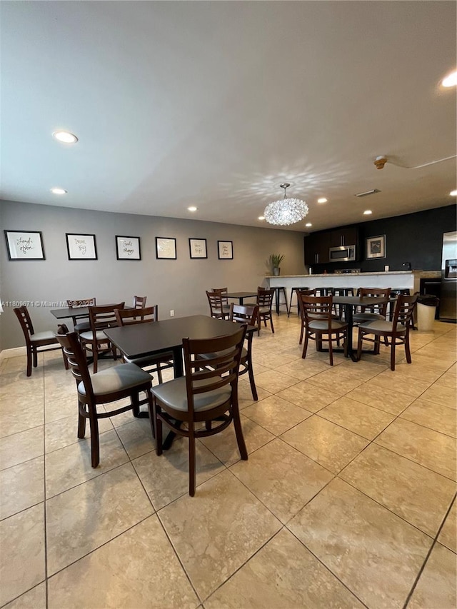 421 NE 1st St Unit 119, Hallandale Beach, FL 33009 - dining space featuring recessed lighting, a chandelier, and light tile patterned floors
