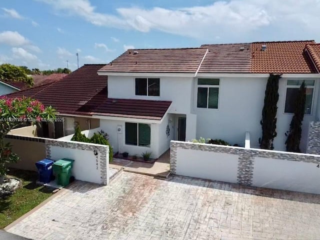 4542 SW 143rd Ct W, Miami, FL 33175 - back of house with a tiled roof and stucco siding