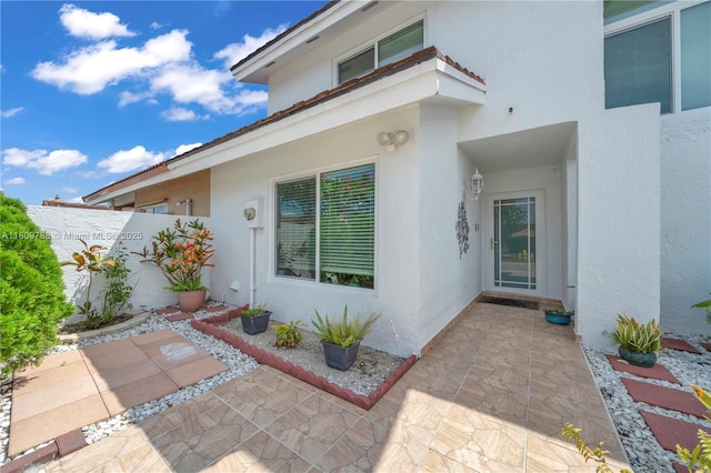 4542 SW 143rd Ct W, Miami, FL 33175 - view of exterior entry featuring a patio and stucco siding