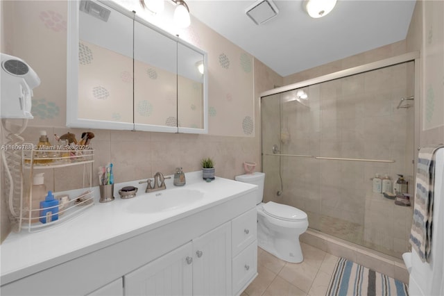 4542 SW 143rd Ct W, Miami, FL 33175 - full bath with toilet, tile walls, vanity, a stall shower, and tile patterned flooring