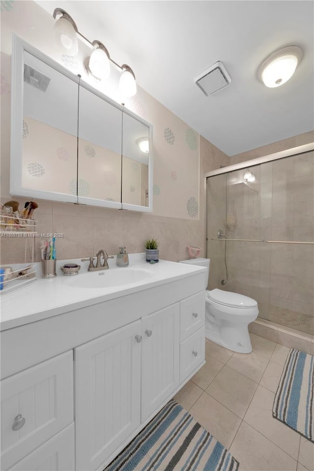 4542 SW 143rd Ct W, Miami, FL 33175 - full bathroom with vanity, a stall shower, toilet, tile walls, and tile patterned floors