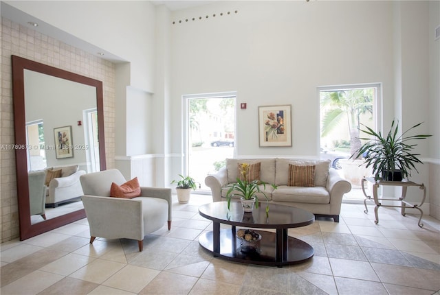 50 SW Menores Ave Unit 732, Coral Gables, FL 33134 - living area with a towering ceiling and light tile patterned floors