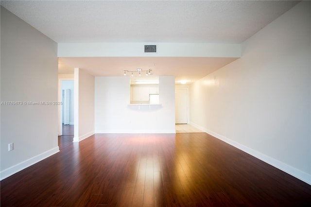 50 SW Menores Ave Unit 732, Coral Gables, FL 33134 - unfurnished room with wood finished floors, baseboards, and rail lighting
