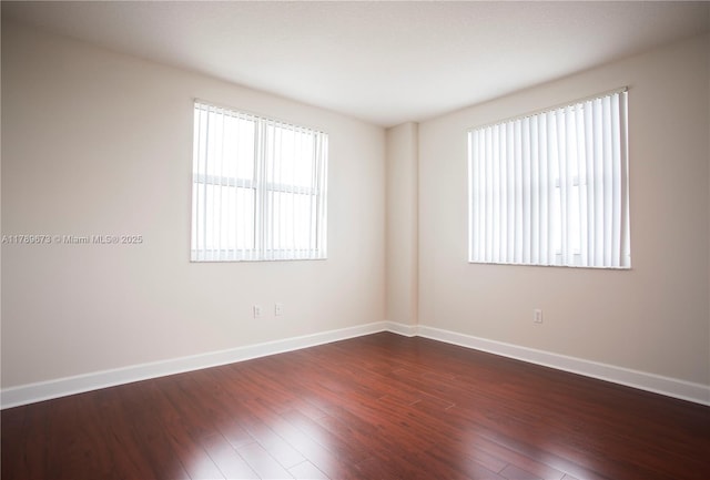 50 SW Menores Ave Unit 732, Coral Gables, FL 33134 - spare room with baseboards and dark wood-type flooring