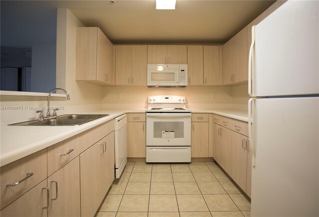 50 SW Menores Ave Unit 732, Coral Gables, FL 33134 - kitchen with white appliances, light brown cabinets, a sink, and light tile patterned flooring