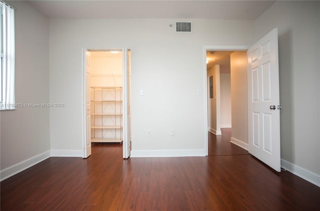 50 SW Menores Ave Unit 732, Coral Gables, FL 33134 - unfurnished bedroom featuring dark wood finished floors and baseboards
