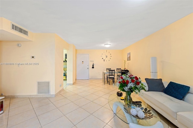 3161 S Ocean Dr Unit 607, Hallandale Beach, FL 33009 - living area featuring light tile patterned flooring and baseboards