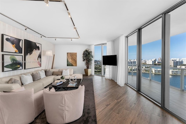 17301 Biscayne Blvd Unit 2210, North Miami Beach, FL 33160 - living area featuring a wall of windows, wood finished floors, and track lighting