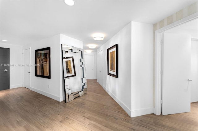 17301 Biscayne Blvd Unit 2210, North Miami Beach, FL 33160 - corridor featuring baseboards and light wood-type flooring
