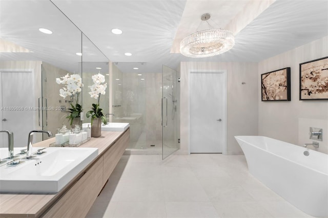 17301 Biscayne Blvd Unit 2210, North Miami Beach, FL 33160 - bathroom featuring a stall shower, double vanity, a soaking tub, tile patterned floors, and a chandelier