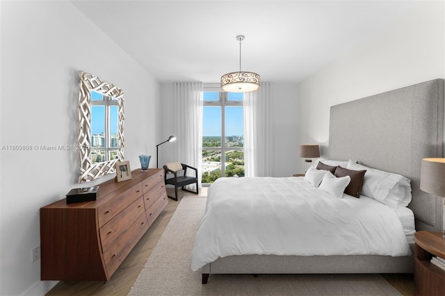 17301 Biscayne Blvd Unit 2210, North Miami Beach, FL 33160 - bedroom featuring light wood-style floors