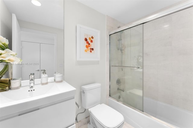 17301 Biscayne Blvd Unit 2210, North Miami Beach, FL 33160 - bathroom with vanity, toilet, and shower / bath combination with glass door