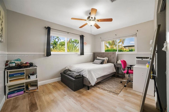 1240 NE 176th St, North Miami Beach, FL 33162 - bedroom with light wood-style flooring, baseboards, and ceiling fan