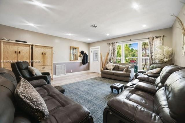 1240 NE 176th St, North Miami Beach, FL 33162 - living area with wood finished floors, baseboards, and recessed lighting
