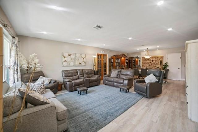 1240 NE 176th St, North Miami Beach, FL 33162 - living area with light wood finished floors and recessed lighting