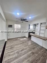 2325 Hayes St, Hollywood, FL 33020 - unfurnished living room with wood finished floors, a ceiling fan, and recessed lighting