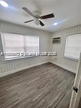 2325 Hayes St, Hollywood, FL 33020 - spare room featuring ceiling fan, recessed lighting, dark wood-style floors, and a wall mounted air conditioner