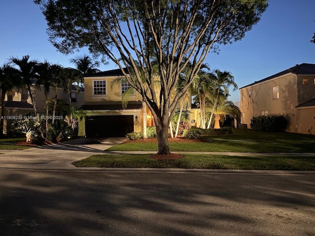 9003 Alexandra Cir, Wellington, FL 33414 - view of front of property with a garage, driveway, stucco siding, and a front lawn
