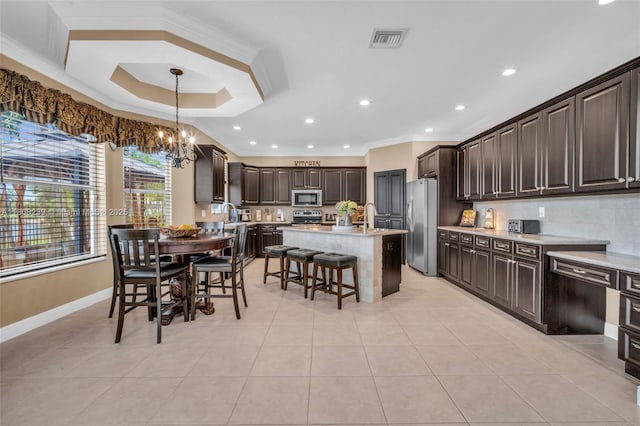 9003 Alexandra Cir, Wellington, FL 33414 - dining room featuring ornamental molding, a chandelier, light tile patterned flooring, recessed lighting, and baseboards