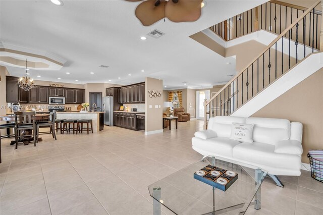 9003 Alexandra Cir, Wellington, FL 33414 - living area featuring ceiling fan, recessed lighting, light tile patterned floors, a chandelier, and stairway