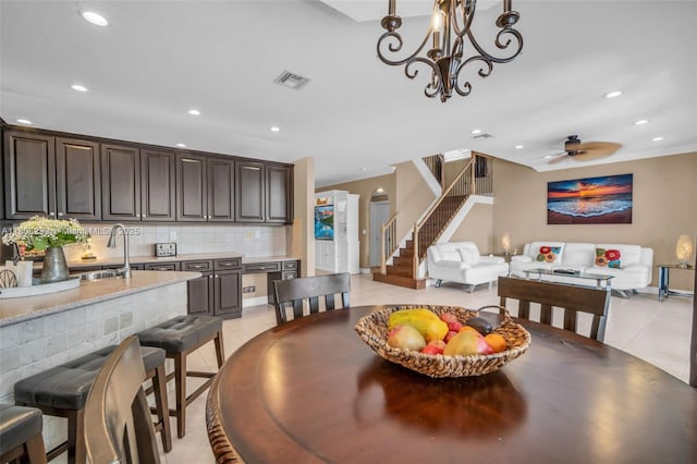 9003 Alexandra Cir, Wellington, FL 33414 - dining space featuring light tile patterned floors, stairs, recessed lighting, a ceiling fan, and baseboards