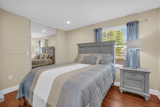 9003 Alexandra Cir, Wellington, FL 33414 - bedroom featuring multiple windows, baseboards, wood finished floors, a closet, and recessed lighting