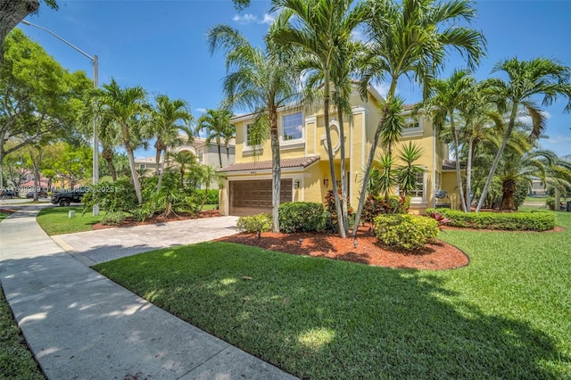 9003 Alexandra Cir, Wellington, FL 33414 - mediterranean / spanish house with concrete driveway, stucco siding, a garage, and a front lawn