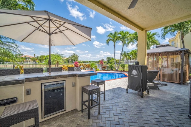 9003 Alexandra Cir, Wellington, FL 33414 - fenced backyard with a patio, an outdoor bar, and area for grilling