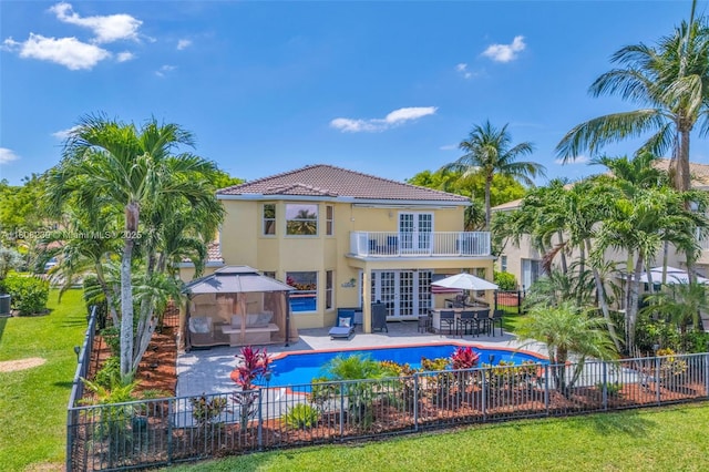 9003 Alexandra Cir, Wellington, FL 33414 - rear view of property with a gazebo, a balcony, stucco siding, french doors, and a patio