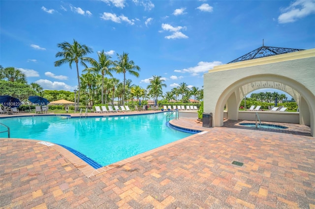 9003 Alexandra Cir, Wellington, FL 33414 - community pool with a patio area and a hot tub