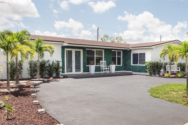 5920 SW 94th Ave, Miami, FL 33173 - rear view of property with stucco siding and french doors
