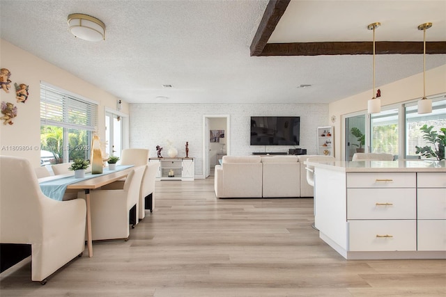 5920 SW 94th Ave, Miami, FL 33173 - dining area featuring a textured ceiling, light wood-style floors, and brick wall