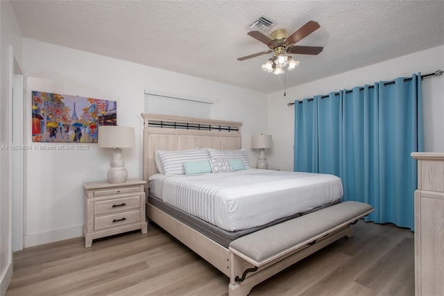 5920 SW 94th Ave, Miami, FL 33173 - bedroom with light wood-type flooring, a textured ceiling, baseboards, and a ceiling fan