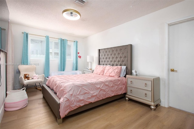 5920 SW 94th Ave, Miami, FL 33173 - bedroom featuring wood finished floors and a textured ceiling