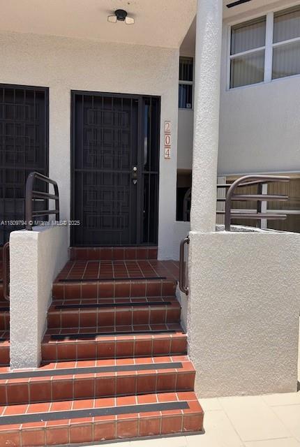 11201 NW 7th St Unit 204, Sweetwater, FL 33172 - entrance to property with stucco siding