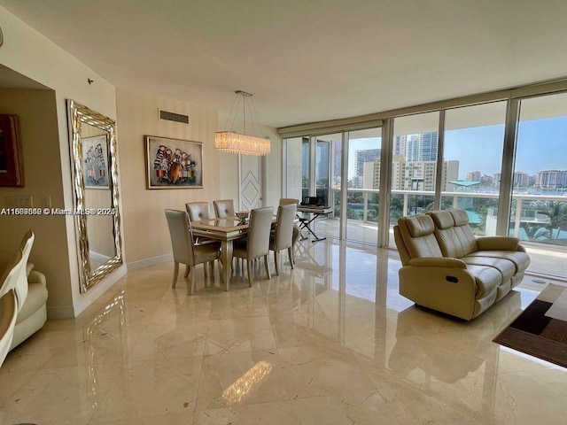 400 Alton Rd Unit 808, Miami Beach, FL 33139 - dining room featuring marble tiled floors, baseboards, a view of city, and expansive windows