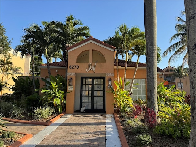 6276 NW 186th St Unit 305, Hialeah, FL 33015 - entrance to property with french doors and stucco siding