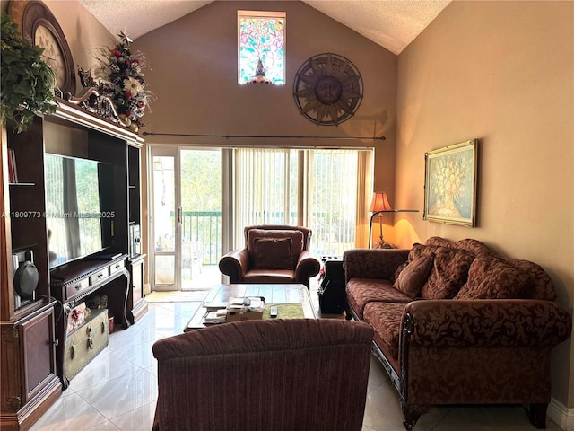 6276 NW 186th St Unit 305, Hialeah, FL 33015 - living room featuring a textured ceiling, light tile patterned flooring, and high vaulted ceiling