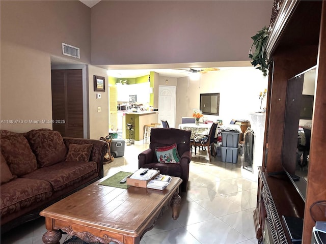 6276 NW 186th St Unit 305, Hialeah, FL 33015 - living room featuring a high ceiling, light tile patterned flooring, and a ceiling fan