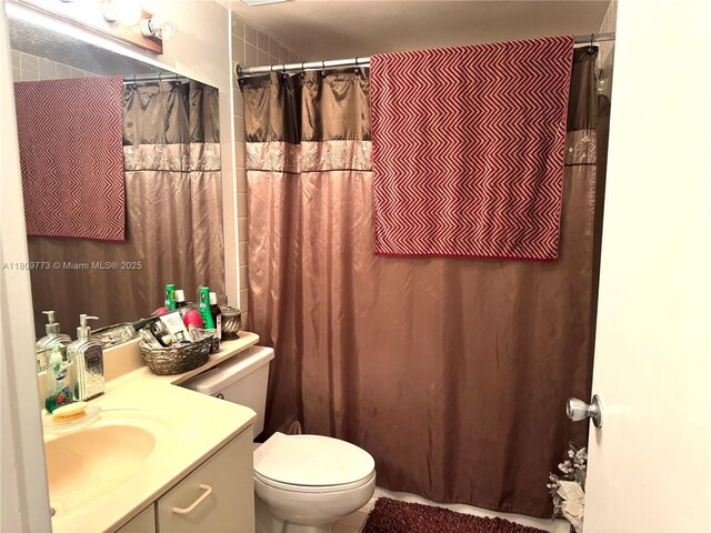 6276 NW 186th St Unit 305, Hialeah, FL 33015 - full bathroom featuring vanity, toilet, and a shower with curtain