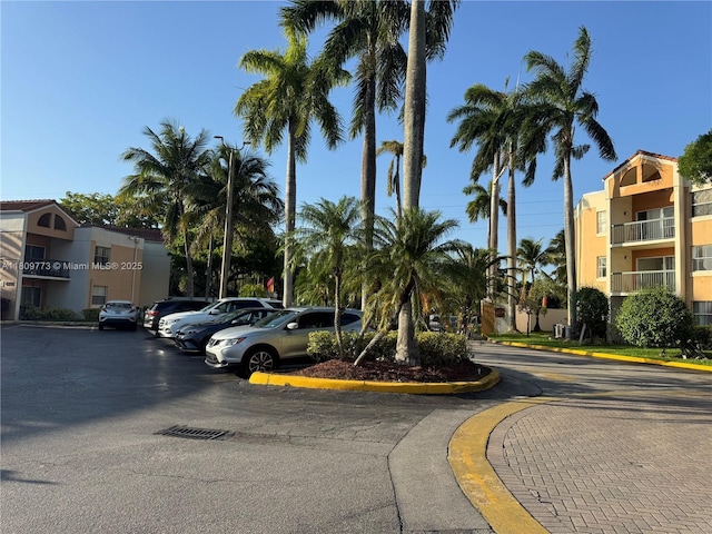 6276 NW 186th St Unit 305, Hialeah, FL 33015 - view of asphalt road with street lighting and curbs