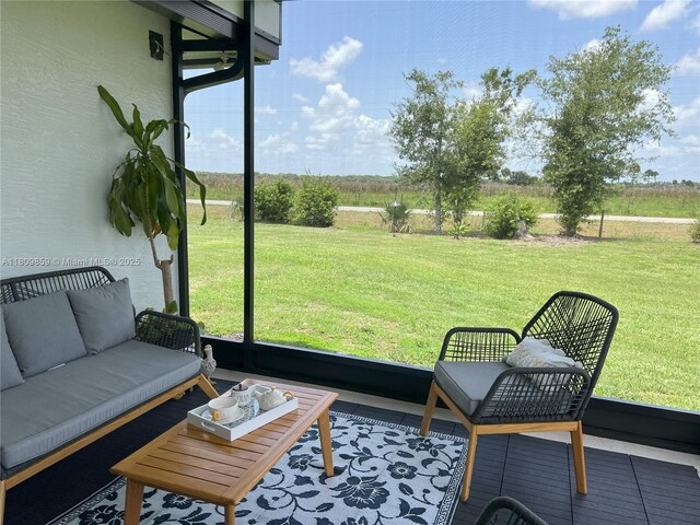 7935 NW 90th Ct, Okeechobee, FL 34972 - sunroom with an outdoor hangout area and plenty of natural light
